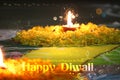 Diwali diya on flower rangoli