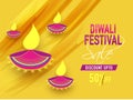 Diwali Festival Sale banner or poster design with 50% discount offer and illuminated oil lamps. Royalty Free Stock Photo
