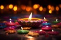 Diwali glowing Diya or oil lamp over colorful Rangoli background - Ai Generated