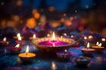 Diwali glowing Diya or oil lamp over colorful Rangoli background - Ai Generated