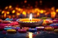 Diwali glowing Diya or oil lamp over colorful Rangoli background - Ai Generated