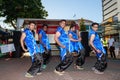 Indian men celebrating Diwali in neon-blue costumes