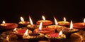 Diwali, Hindu festival of lights celebration. Diya oil lamps against dark background Royalty Free Stock Photo