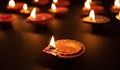 Diwali, Hindu festival of lights celebration. Diya oil lamps against dark background Royalty Free Stock Photo