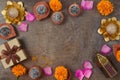 Diwali holiday border frame background with sweet traditional dessert, gift box and decorations. Top view, flat lay