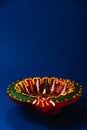 Diwali joy captured in the glow of colorful clay diya lamps, signifying prosperity and happiness,