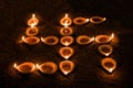 Diwali oil lamp or diya arranged to form swastik symbol