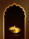 Diwali oil lamp over dark brown background Royalty Free Stock Photo