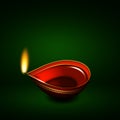 Diwali oil lamp over green background Royalty Free Stock Photo