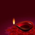 Diwali oil lamp over rouge background Royalty Free Stock Photo