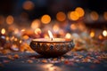 Diwali\'s essence a diya lamp amidst a blurred festival of light celebration