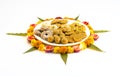 Homemade snacks with flowers kept with rangoli Royalty Free Stock Photo