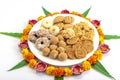 Homemade snacks with flowers kept with rangoli Royalty Free Stock Photo