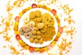 Homemade snacks with flowers kept with rangoli Royalty Free Stock Photo