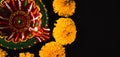 Diwali's radiance shines through, A stunning Diwali lamp and intricate flower rangoli on a