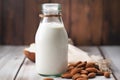 diy almond milk in a rustic glass bottle on a wooden table