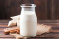 diy almond milk in a rustic glass bottle on a wooden table