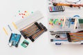 DIY arduino. Flat layout on white background, copy space. Electronic workshop components.