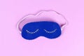 Diy blue felt sleep mask with white thread embroidered with closed eyes with eyelashes on gum