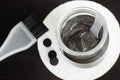 DIY charcoal face mask in a small glass jar. Homemade cosmetics.