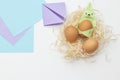 DIY Children's Easter craft bunny with an egg. Easter paper step by step instructions. Happy bunny holds egg.