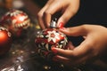 DIY Christmas decor: woman handcrafting balls