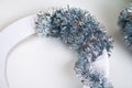 Diy Christmas wreath. Guide on the photo how to make a Christmas wreath with your own hands from a cardboard plate, tinsel, beads Royalty Free Stock Photo