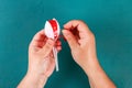 Diy cinco de mayo maracas from eggs, spoons and cereals on a green background