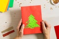 DIY concept. How to make Christmas card. New Year idea for children.