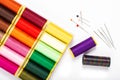 DIY concept multicolor Sewing thread and needle on white back gr Royalty Free Stock Photo