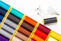 DIY concept multicolor Sewing thread and needle on white back gr Royalty Free Stock Photo