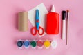 DIY crafts for kids, toilet tube roll, paper, glue, scissors, paint and brush on pink backround. Step by step, New Year Royalty Free Stock Photo