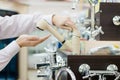 DIY department shopping: closeup on businessman hands choosing and touching for buying faucet, crane or water tap on shop display Royalty Free Stock Photo