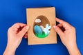 Diy Easter cards from paper. Volume greeting cards with a bunny, egg on blue background. 3d Royalty Free Stock Photo