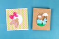Diy Easter cards from paper. Volume greeting cards with a bunny, egg on blue background. 3d Royalty Free Stock Photo