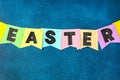 Diy Easter garland bunnies, flags EASTER made paper blue background. Gift idea, decor Spring, Easter Royalty Free Stock Photo