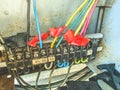 DIY electrical box. small cables, nails and wires in a box for connecting and distributing the electrical network in the house. Royalty Free Stock Photo