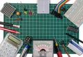 DIY electrical maker tools components on green cutting mat board. Royalty Free Stock Photo