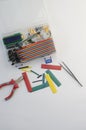 DIY electronics hobby kit opened heatshrink laying around on the grey background. DIY engineer electronic kit set. Royalty Free Stock Photo