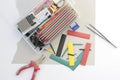 DIY electronics hobby kit opened heatshrink laying around on the grey background. DIY engineer electronic kit set. Royalty Free Stock Photo