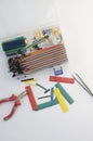 DIY electronics hobby kit opened heatshrink laying around on the grey background. DIY engineer electronic kit set. Royalty Free Stock Photo