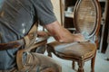 diy enthusiast sanding a chair for upcycling
