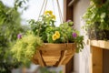 diy garden project with a hanging basket, planter, and greenery