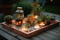 diy garden project with succulent plants, tealights and copper tray