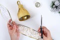 DIY gold bell from a plastic bottle. Guide on the photo how to make a decorative bell from a bottle, paper and a Christmas ball