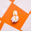 DIY Halloween candy ghost step by step. Image three. Wrap the candy and tie it with ribbon.