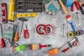 DIY and home improvement banner with work and construction tools on a wooden workbench top view, copy space at center. Royalty Free Stock Photo