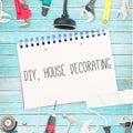 Diy, house decorating against tools and notepad on wooden background