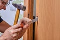 DIY installation of latch in door, groove is cut out with chisel for lock plate