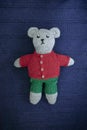 DIY knitted bear toy. Sweet, soft woollen teddy bear handmade Royalty Free Stock Photo